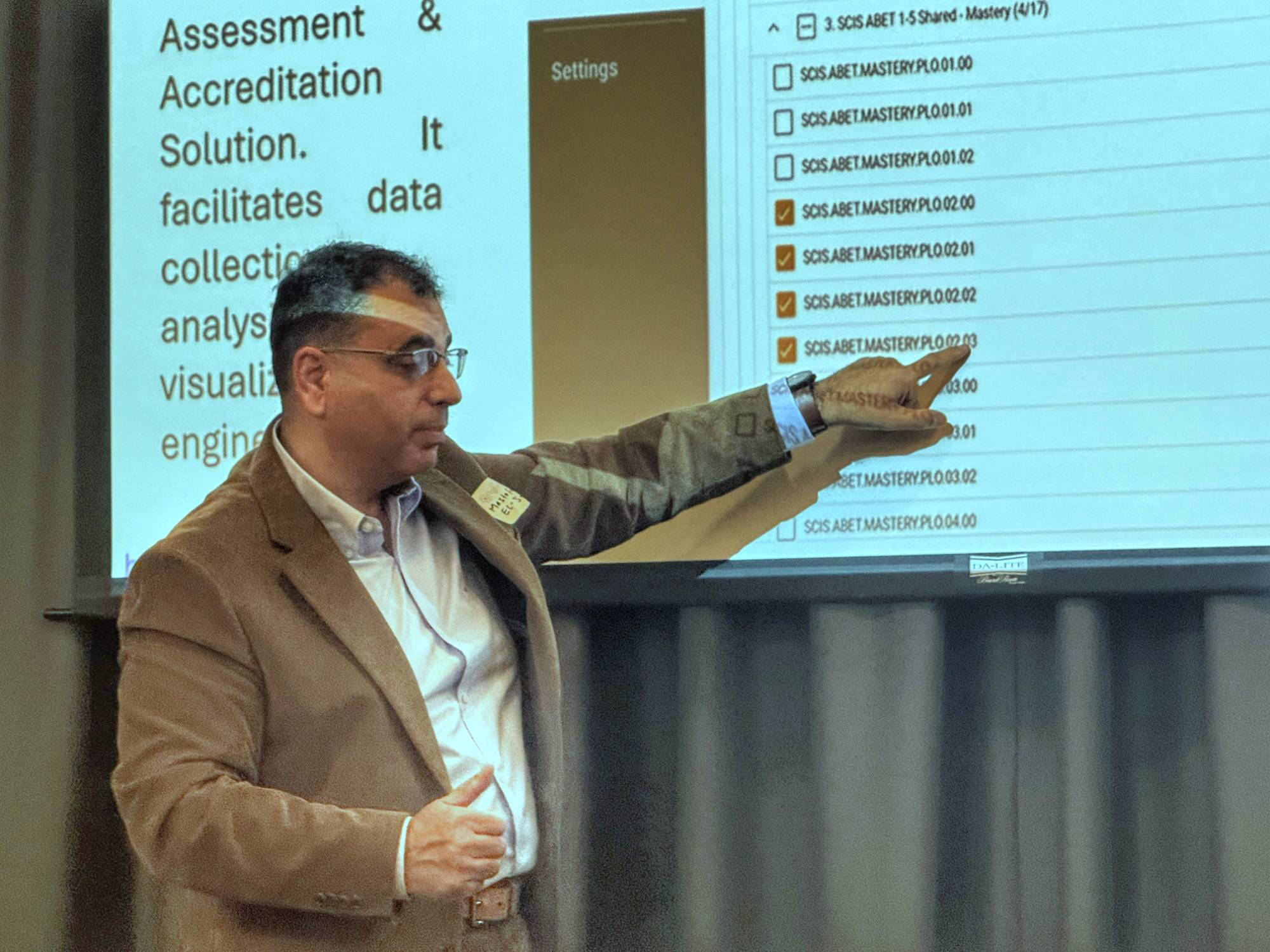 Mostafa El-Said presents on the use of EAC in the College of Computing